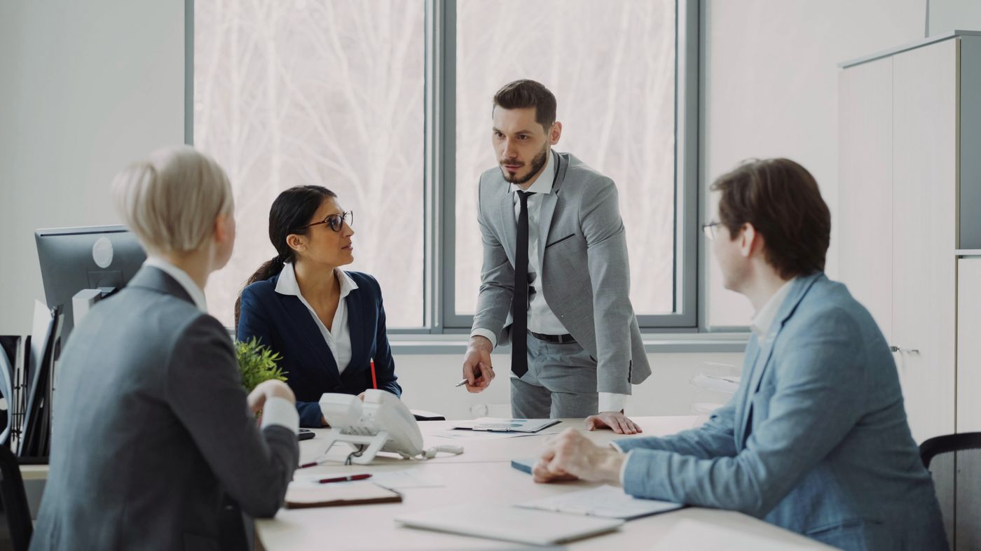 A team discussing next business steps at a meeting table